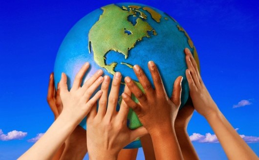 Hands on a globe --- Image by © Royalty-Free/Corbis